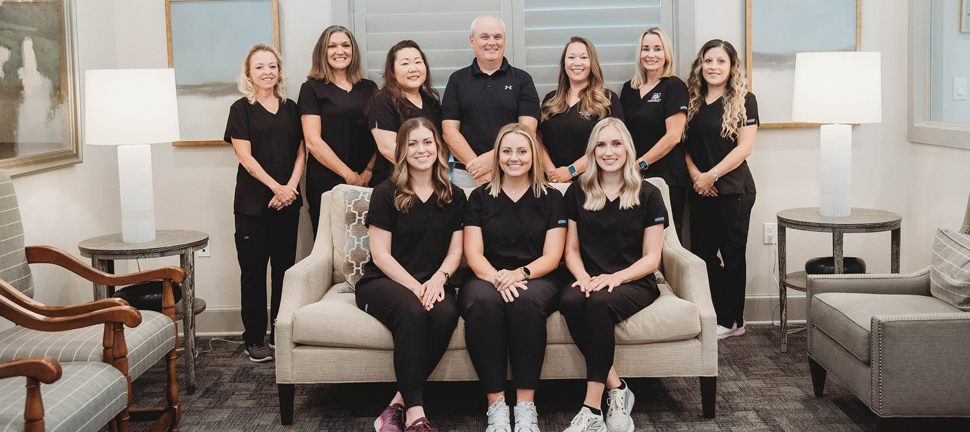 Smiling dentist and dental team members in Tyler