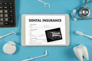 Dental insurance and dental products on blue background
